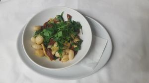 Vegan Gnocchi with sundried tomato, wilted spinach, courgette ribbons & pine nuts at The Golden Heart Inn in Gloucester