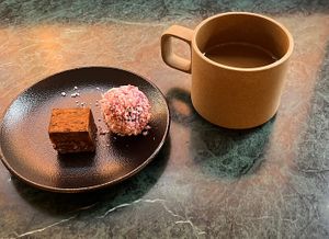 Coffee with caramel chocolate praline and berry ball  at Pepstop - Riddargatan in Stockholm