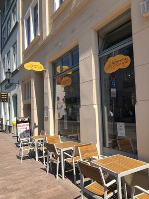 view on the street (but it is not very busy) at Werners Eiscafe in Wismar