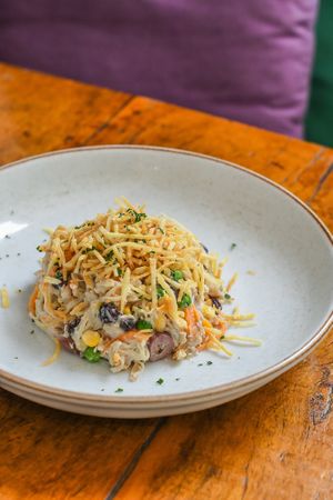 Smoked Salpicão | Sinal do Vale jackfruit, In 
Natura hearts of palm salad, smoked Uai tofu, peas, corn, carrots, raisins, olives, red onion, housemade mayo, potato sticks, pars at Teva in Rio De Janeiro