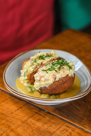 ACARAJÉ
Housemade black eyed peas fritters, creamy caruru peanut sauce, grilled okra, spicy hearts of palm and tomate salsa, red palm oil, cilantro. at Teva in Rio De Janeiro