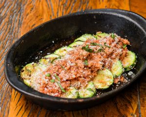 Grilled zucchini, Trapanese pesto (sundried tomato, tomato, almonds and basil), sundried tomato panko, parmesan. at Teva in Rio De Janeiro