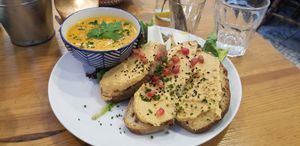 Soup with bread and peanut sweet potato hummus + side salad at Kitchen Garden in Bordeaux