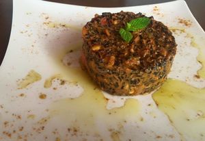 "Black Sand Risotto" with mushrooms, raisins, pine nuts, fresh ginger, chilly, sage- in coconut sauce  at Sea Vibe in Santorini