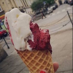 half eaten vegan malibu and forest fruit flavour on a gluten free cone at Good Lood in Krakow