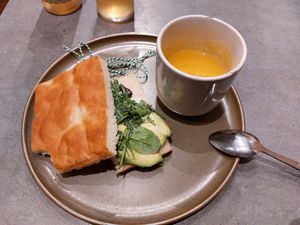 Already took a bite from the focacia and had a few teaspoons of soup. at The Sister in Brussels