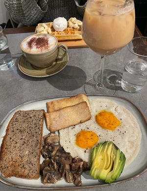 Vegan breakfast and iced oat latte, coconut cappuccino and gluten/ dairy free waffles   at The Sister in Brussels