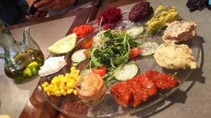 Antipasti plate with a bunch of hummus, dried tomatoes, ... at The Sister in Brussels