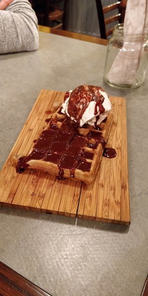 Vegan waffle with soy vanilla ice cream and vegan chocolate sauce at The Sister in Brussels