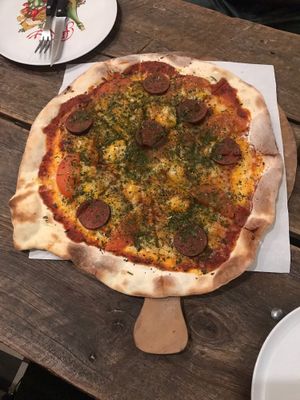 Vegan pizza with vegan cheese and salami  at Pizza Loft in Krakow