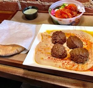 Hummus plate is served with warm pita. We added falafels and a side of veggies. Pro tip: we got the veggies "on the house" because it was our first time trying Brassica.  at Brassica in Columbus