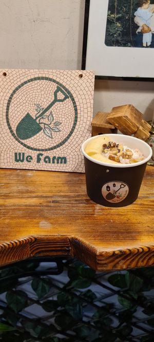 Ice cream with freshly chopped banana, nuts and dates on top at We Farm in Amman