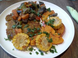 potato and carrot flat cakes with corn pumpkin and veggies at veganka in Katowice