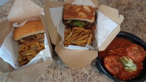 Vegan takeout:  County-fried mushroom burger, Veggie burger (center), and "meatballs" with zucchini noodles at 56 Kitchen in Solon