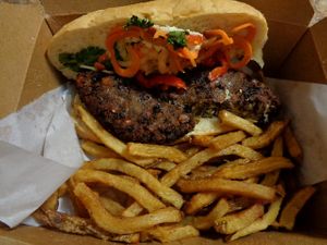 Vegan Banh Mi. House-made vegan meatballs (bean and grain blend patties), pickled vegetables, cilantro, tofu aioli, sriracha agave sauce, French baguette. at 56 Kitchen in Solon