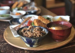 Delicious brown rice with adzuki beans topped with sesame seeds. Side dishes also all excellent. Local vegetables seasoned to perfection.  at Kuriya in Hamamatsu