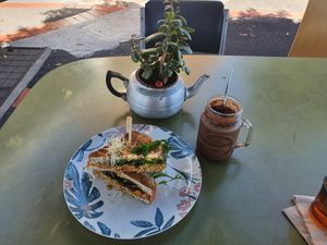 Iced Mocha with home made Macademia milk and the chickmade sandwich at Particle Cafe in Avondale Heights