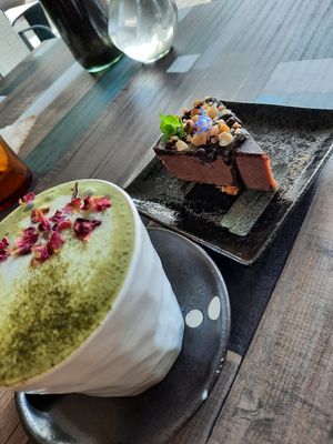 Ferror Rocher raw slice with Matcha macadamia latte at Particle Cafe in Avondale Heights