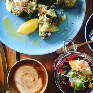 macadamia feta and avo on toast with peanut butter and cacao chia pudd  at Particle Cafe in Avondale Heights