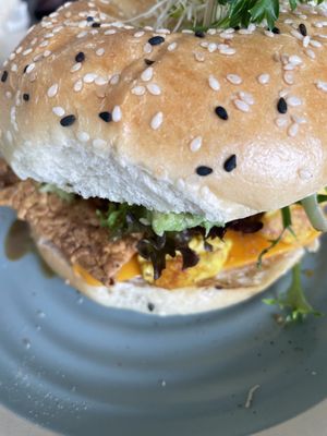 Breakfast bagel with added rice paper bacon  at Particle Cafe in Avondale Heights