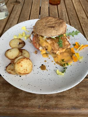 Jackfruit burger with crunchy potatoes, delicious! at Particle Cafe in Avondale Heights