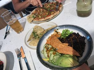 Garlic pizza, Italian sausage pizza and kimchi pancake bowl at Stem & Glory in Cambridge