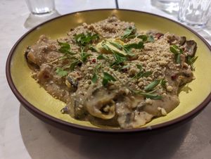 Mushroom sauce with pumpkin ravioli, with nut "parmesan" at Stem & Glory in Cambridge