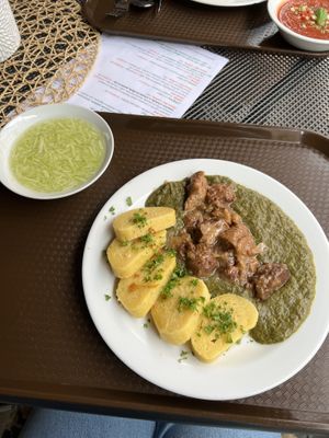 Seitanové výpečky - seitan with potato dumplings and spinach. Cucumber salad.  at Slunce in Ceske Budejovice