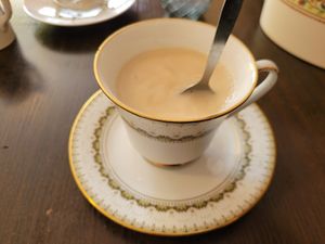 Darjeeling tea with oat milk at Hidden Lane Tea Room in Glasgow