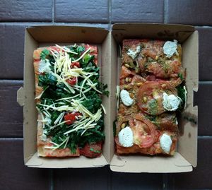 Two pizzas i brought back home, not enough stuff on it i think. at Hank Vegan Pizza in Paris