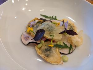 Celeriac ravioli filled with a garlic cashew cream with avocado mayonnaise at Le Cheval Blanc  in Saint-antonin-noble-val