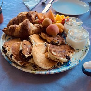 Croissants, yoghurt, American blueberry pancakes   at Le Cheval Blanc  in Saint-antonin-noble-val
