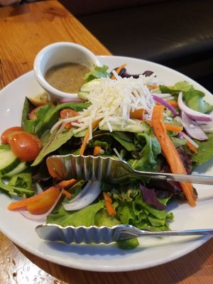 Salad with non-dairy cheese at Patxi's Pizza in Santa Barbara