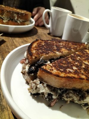Mushroom toastie with house made vegan cashew cheese. Also contains hazelnuts, pickled onion and basil. So good! at KINES in Brunswick