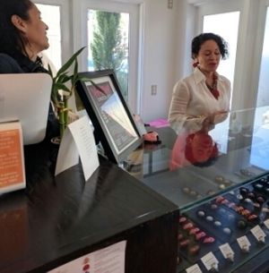 the owner on the left is a vegan at WOW Chocolates in Bellevue