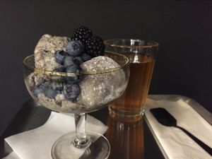 Gluten-free/dairy-free/refined-sugar-free vegan dessert of the week: black sesame seed ice cream served with daifuku mochi and organic blackberries & blueberries + chilled scented tea  at Namban Oporto Kitchen Cafe in Porto