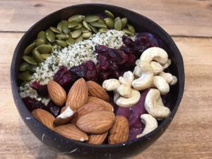 What a great acai bowl -- lots of purple goodness under this tableau. ❤️ at Belem Cafe & Yoga in Montreal