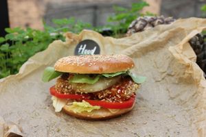 Sweet baby burger with tofu and chill sauce, fresh spinach and grill pineapple at Hood - Konyushennaya in St Petersburg