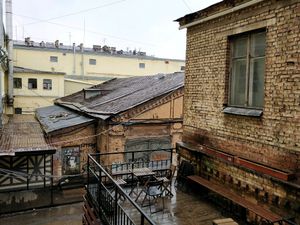 small dining area above the restaurant but no shelter against wet weather at Hood - Konyushennaya in St Petersburg
