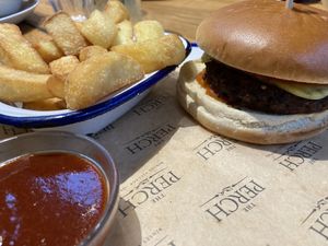Vegan cheeseburger and chips  at The Perch in Oxford
