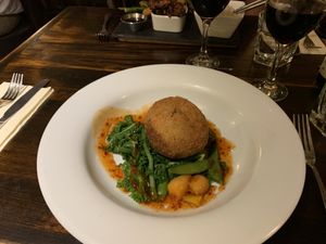 Mushroom risotto Bon Bon with wilted greens- absolutely delicious! Nice and crunchy on the outside, filled with a creamy risotto and a chilli jam centre. Beautiful!  at The Gardener's Arms in Alderton