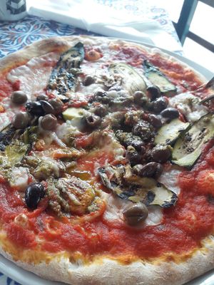 Stracciatella vegan pizza is on the menu with vegan mozzarella and pesto. Costs only about 5-6 euros or something like that. at Desenzanino in Desenzano Del Garda