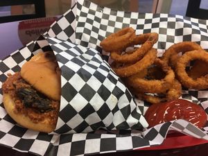 Chili cheese black bean veggie burger and onion rings at PJ's Grill in Carson