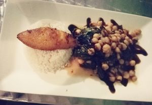 Sautéed Spinach and Garbanzos drizzled with Balsamic Glaze and served with White Rice and Sweet Plantain at Yardie Spice in Homestead