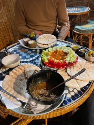 Bean goulash, hummus, pita bread with seasoning and olives at Dobra Cajovna in Karlovy Vary
