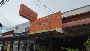 Business name and sign.   at Cafe Namaste in Jaco