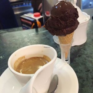 Espresso comes along with a tiny ice cone. It's too sweet! at Lilly's Eiscafe in Duisburg