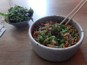 nudles with vegetables and side salad at Marukoshi in Belgrade