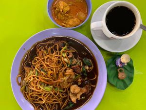 Hokkien Mee with a small bowl of curry and coffee black 
Photo credit to Henry Lau at Happy Vegetarian - Ang Mo Kio in Northeast Singapore