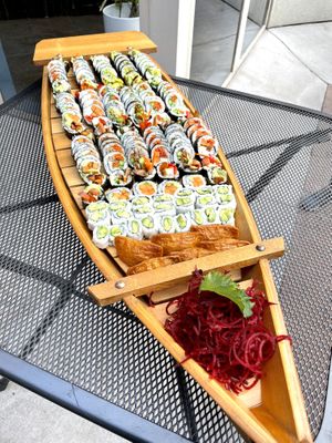 Three vegan party platters on a sushi boat 🍣🍱  at Sushi 101 Bar & Grill in Tempe